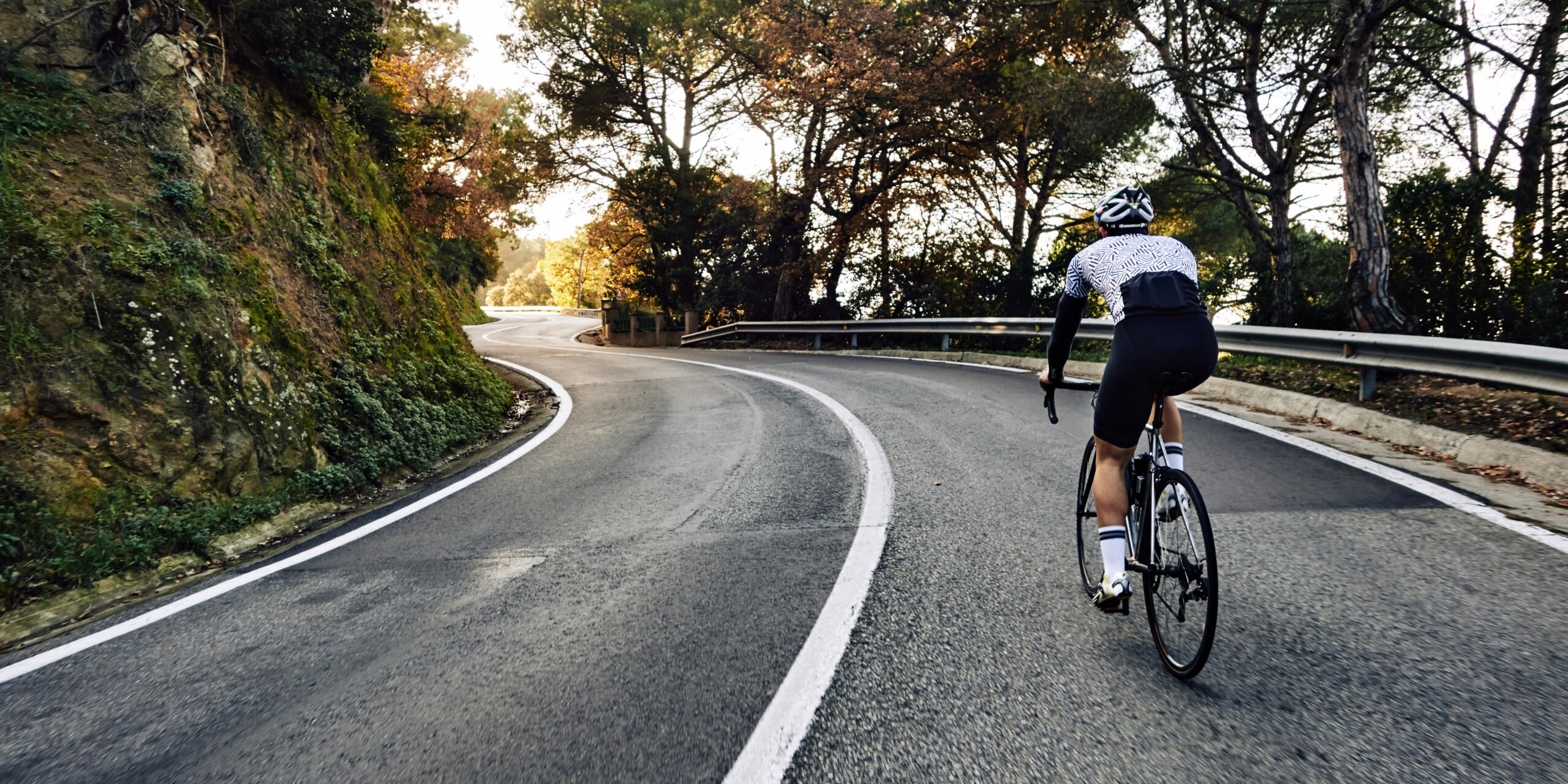 Cyclist man riding a bike on the road go to target for design or decorate cycling sport, business, finance, bangking